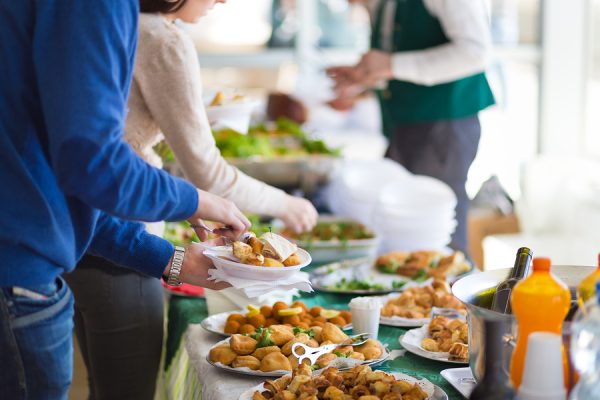 Banquet lunch break at conference meeting. Assortment of food and beverage.